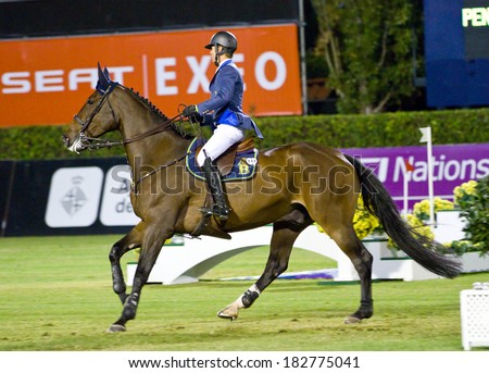 BARCELONA, SPAIN - SEPTEMBER 23: Latham Rutherford from Spain in action during the CSIO 100th International Jumping Competition, on September 23, 2011, in Real Club de Polo, Barcelona, Spain.