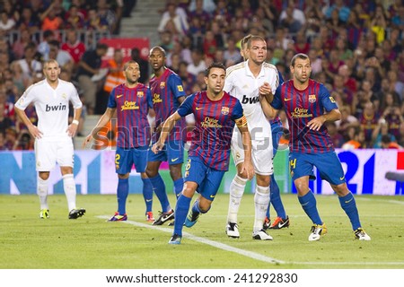 BARCELONA - AUGUST 17: Some players in action at the Spanish Super Cup final match between FC Barcelona and Real Madrid, 3 - 2, on August 17, 2011 in Camp Nou stadium, Barcelona, Spain.