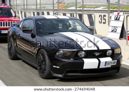 VALENCIA, SPAIN - APRIL 25: A black 2013 Ford Mustang take part in American Fest weekend organizated in circuit Ricardo Tormo, on April 25, 2015, in Cheste, Valencia, Spain.