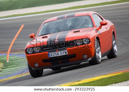 VALENCIA, SPAIN - APRIL 25: A red Dodge Challenger RT take part in American Fest weekend organizated in circuit Ricardo Tormo, on April 25, 2015, in Cheste, Valencia, Spain.