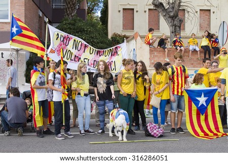 BARCELONA - SEPTEMBER 11: Catalans made a 400 km human chain to show their desire for independence from Spain, on Sept. 11, 2013 in Barcelona, Spain. More than 1 million people took part in the event.