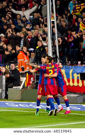 BARCELONA - DECEMBER 13: Nou Camp stadium, Spanish Soccer League match: FC Barcelona - Real Sociedad, 5 - 0. In the picture, players celebrating a goal. December 13, 2010 in Barcelona (Spain).