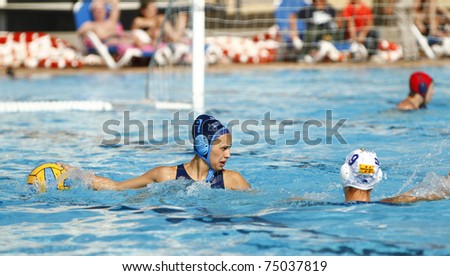 BARCELONA - APRIL 10: Water polo player in action during the women Spanish league match between CN Mataro and Sant Andreu, final score 4 - 7. April 10, 2011 in Mataro (Spain).