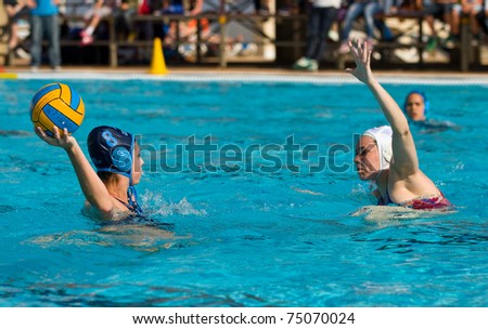 BARCELONA - APRIL 10: Water polo players in action during the women Spanish league match between CN Mataro and Sant Andreu, final score 4 - 7.on April 10, 2011 in Mataro, Barcelona, Spain.