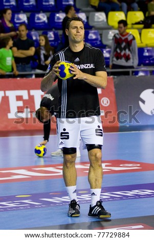 BARCELONA - APRIL 24: Jerome Fernandez (No. 77) during the handball Champions League match between Barcelona and THW Kiel on April 24, 2011 in Barcelona, Spain. The final score, 27 - 25.