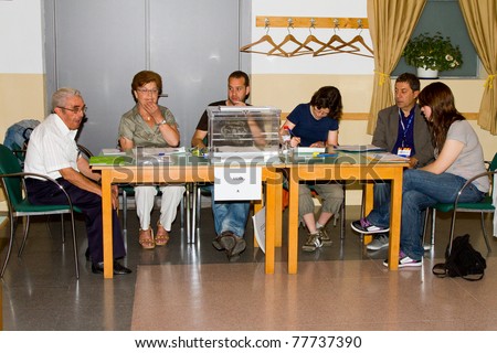 BARCELONA - MAY 22: Unidentified volunteers man the polling station during Spanish municipal elections, on May 22, 2011 in Barcelona, Spain.