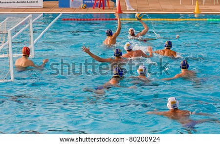 BARCELONA - OCTOBER 16: Unidentified players in action during water polo Quadis Tournament match between CN Mataro and CN Catalunya on October 16, 2010 in Mataro, Barcelona, Spain. Final score 15 - 6.
