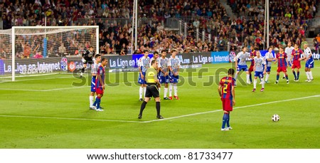 BARCELONA - MAY 15: Dani Alves (2) shooting a free kick during the Spanish league match between FC Barcelona and Deportivo, 0 - 0, on May 15, 2011 in Camp Nou Stadium, Barcelona, Spain.