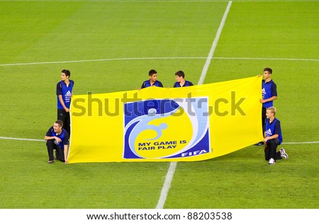 BARCELONA - SEPTEMBER 4: Unidentified people with FIFA Fair Play flag before the friendly match between Mexico and Chile, 1 - 0, on September 4, 2011, in Cornella stadium, Barcelona, Spain.