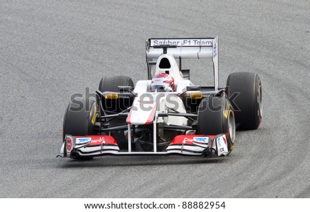BARCELONA - FEBRUARY 18: Kamui Kobayashi of Sauber team driving his F1 car during Formula One Teams Test Days at Catalunya circuit, on February 18, 2011 in Barcelona, Spain.
