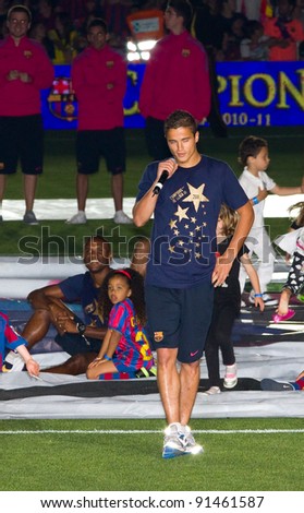 BARCELONA - MAY 13:Ibrahim Afellay talks during FC Barcelona celebration of Spanish League Championship victory in Camp Nou stadium, on May 13, 2011 in Barcelona, Spain.