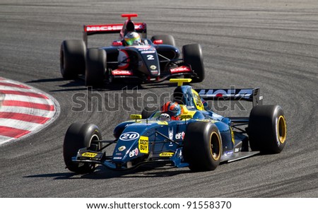 BARCELONA - OCTOBER 9: Jake Rosenzweig (20) and Arthur Pic (2) racing at Formula Renault 3.5 World Series, on October 9, 2011, in Circuit de Catalunya, Barcelona, Spain.
