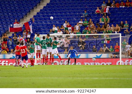BARCELONA - SEPTEMBER 4: Unidentified player of Chile shoot a free kick during the friendly match between Mexico and Chile, final score 1 - 0, on September 4, 2011, in Cornella, Barcelona, Spain.