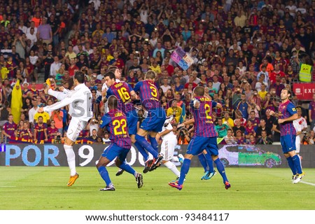 BARCELONA - AUGUST 17: Players in action during the Spanish Super Cup final match between FC Barcelona and Real Madrid, 3 - 2, on August 17, 2011 in Camp Nou stadium, Barcelona, Spain.