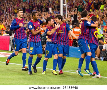 BARCELONA - AUGUST 17: Players celebrating the goal of Leo Messi (min. 88) during the Spanish Super Cup final match between FC Barcelona and Real Madrid, 3 - 2, on August 17, 2011 in Barcelona, Spain.