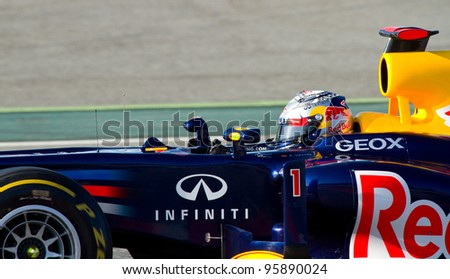 BARCELONA - FEBRUARY 21: Sebastian Vettel of Red Bull Racing F1 team races during Formula One Teams Test Days at Catalunya circuit on February 21, 2012 in Barcelona, Spain.