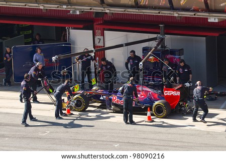 BARCELONA - FEBRUARY 24: Jean Eric Vergne of Toro Rosso F1 team in the pit during Formula One Teams Test Days at Catalunya circuit on February 24, 2012 in Barcelona, Spain.