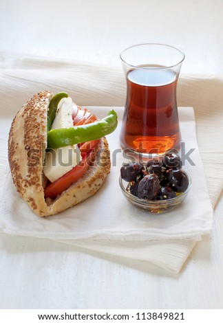 Breakfast with turkish sandwich, tea and black olives