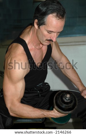 Man lifting weights in the gym