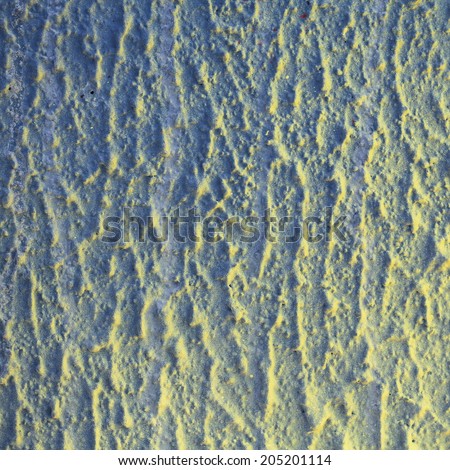 Unusual abstract colorful yellow and blue shadowed painted wall background texture