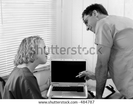 Two doctors; nurses or medical students consulting; black and white