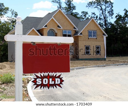 New home being constructed with blank realtor sign and \