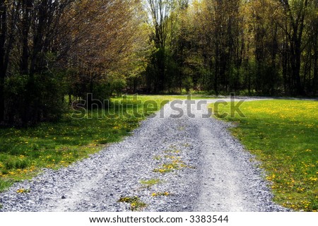 Gravel road winds through the countryside