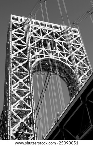 The George Washington Bridge crosses over the Hudson River from New Jersey to The Bronx, New York.  Black and white.