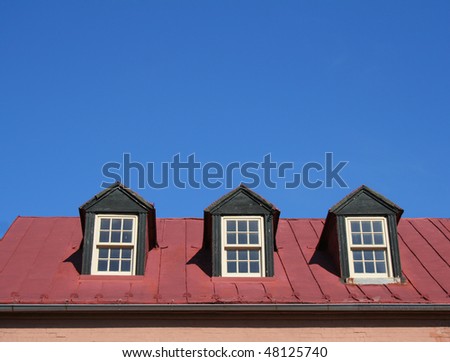 Dormer windows on roof of old building