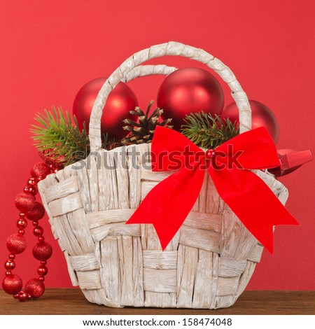 Beautiful Christmas Gift Basket on red background
