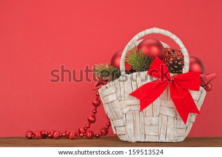 Beautiful Christmas Gift Basket on red background