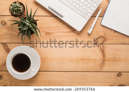Office table with cup of coffee