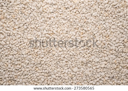 A flat background of small grey pebbles for background or texture