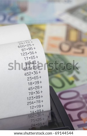 Calculator paper tape with euro bills