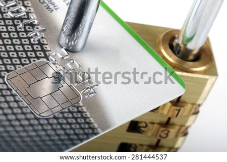 close up of credit card and padlock - secure payment concept