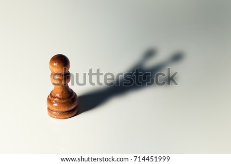 trust yourself, self confident concept - chess pawn with king shadow Foto d'archivio © 