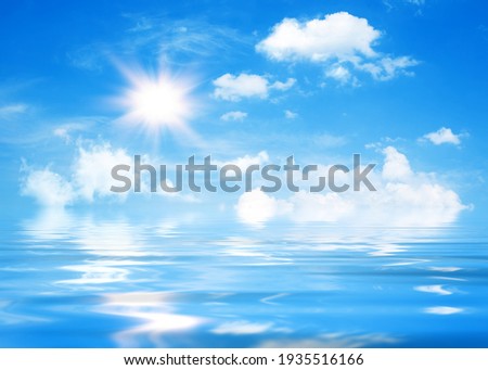 Natural sunny background, blue sky with white cumulus clouds and shining sun.