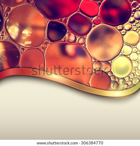Abstract background with oil drops on water, macro with copyspace.