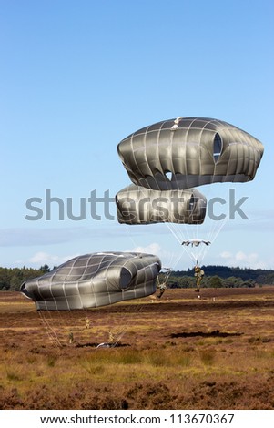 EDE, NETHERLANDS - SEP 22: Para troopers land on Dutch soil during the Operation Market Garden memorial on Sep 22, 2012 near Ede, Netherlands. Market Garden was a large Allied operation in 1944