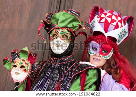VENICE - FEB 5: Costumed couple on the San Marco square during Carnival on Feb 5, 2013 in Venice, Italy. This year the Carnival was held between January 26 - February 12.