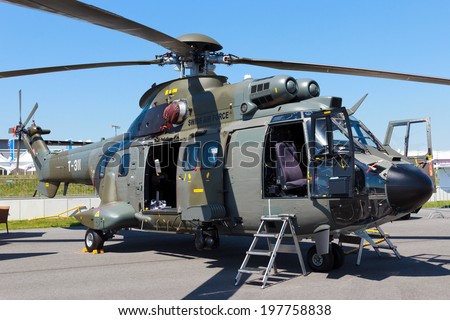 BERLIN, GERMANY - MAY 22: Swiss Air Force AS332 Super Puma transport helicopter at the International Aerospace Exhibition ILA on May 22nd, 2014 in Berlin, Germany.