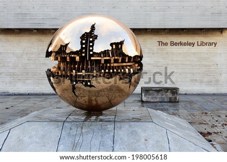 DUBLIN, IRELAND - FEB 15: Abstract spherical metal sculpture on a courtyard of Trinity College in Dublin, Ireland on Feb 15, 2014. Trinity College is the oldest University of Ireland.