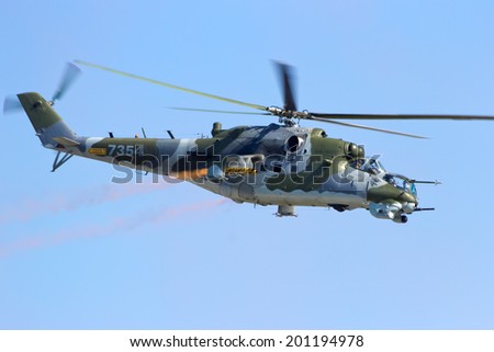BERLIN, GERMANY - MAY 22: Czech Air Force Mi-24V attack helicopter flying a demonstration at the International Aerospace Exhibition ILA on May 22nd, 2014 in Berlin, Germany.