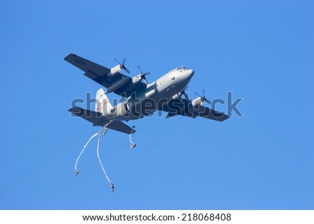 GROESBEEK, NETHERLANDS - SEP 18: Hercules plane drops paratroopers from the 82AD at Market Garden memorial on Sep 18, 2014 in Groesbeek,Netherlands. Market Garden was a large Allied operation in 1944.