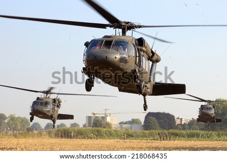 GRAVE, NETHERLANDS - SEP 17: American Black Hawk helicopters take off at the Operation Market Garden memorial on Sep 17, 2014 Grave, Netherlands. Market Garden was a large Allied operation in 1944.