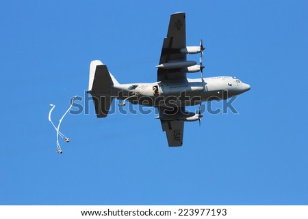 GROESBEEK, NETHERLANDS - SEP 18: Hercules plane drops paratroopers from 82AD at Market Garden memorial on Sep 18, 2014 in Groesbeek,Netherlan ds. Market Garden was a large Allied operation in 1944.