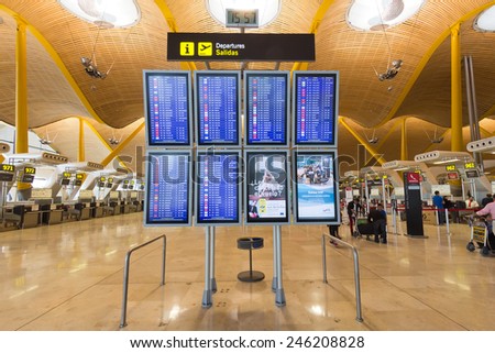 MADRID - OCT 11: Departure information boards at Madrid Barajas International Airport on Oct 11, 2014 in Madrid, Spain.  The airport is Spain\'s largest and busiest airport, and Europe\'s sixth busiest.