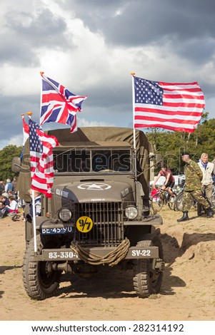 EDE, NETHERLANDS - SEP 22, 2012: 1943 GMC CCKW truck in a parade during the Market Garden Memorial. Operation Market Garden was a large Allied military operation in September 1944.