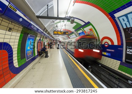 LONDON - JUL 2, 2015: A train arrives at the Piccadilly Circus underground station. London Underground is the 11th busiest metro system worldwide with 1.1 billion annual rides.