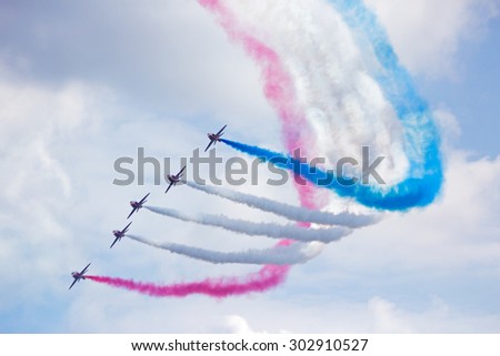 GILZE RIJEN, THE NETHERLANDS - JUNE 21: RAF Red Arrows performing at the Dutch Air Force Open House. June 21, 2014 in Gilze-Rijen, The Netherlands